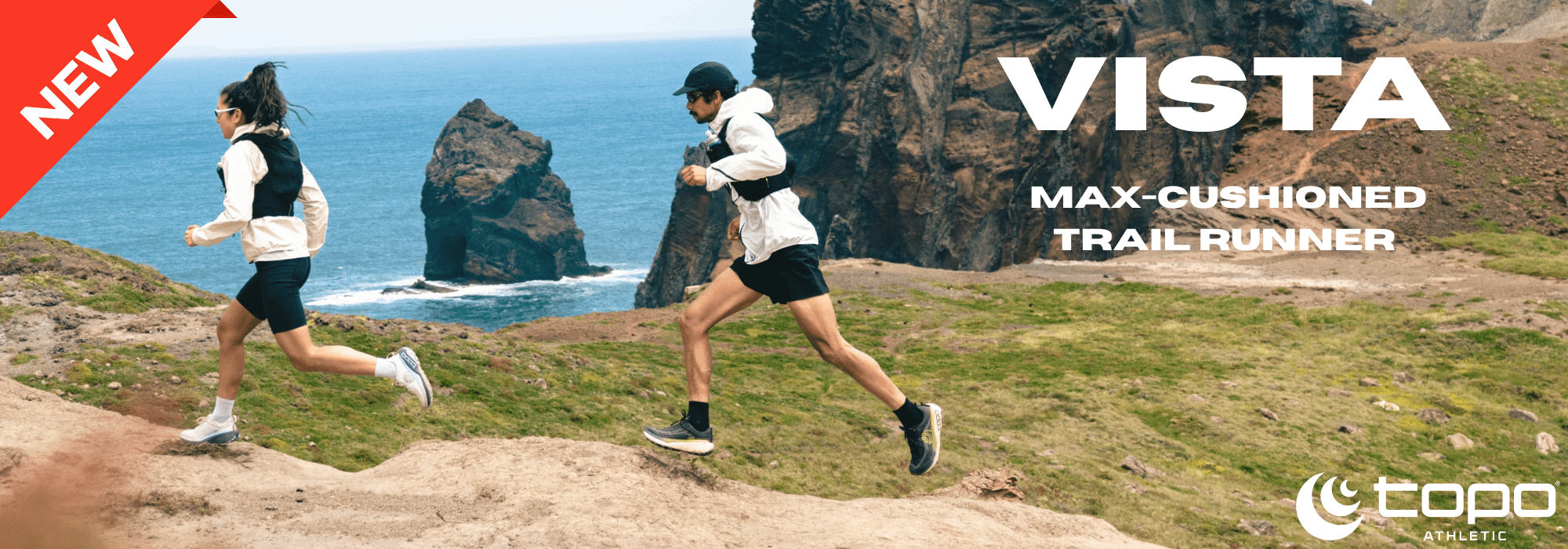 Two runners on a trail with scenic ocean view, promoting 'Vista' max-cushioned trail runner by Topo.